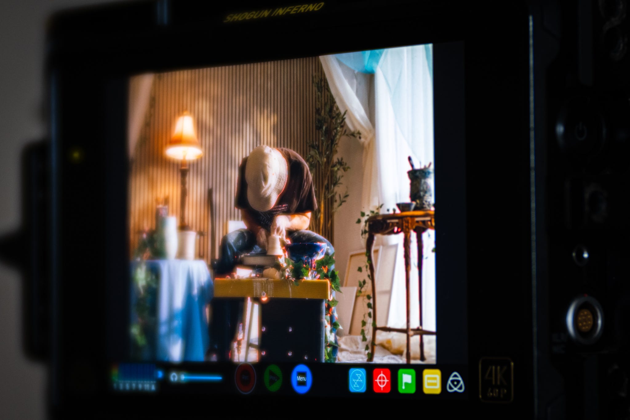 Production monitor showing Spencer Tracy Brown working at the ceramics wheel during filming