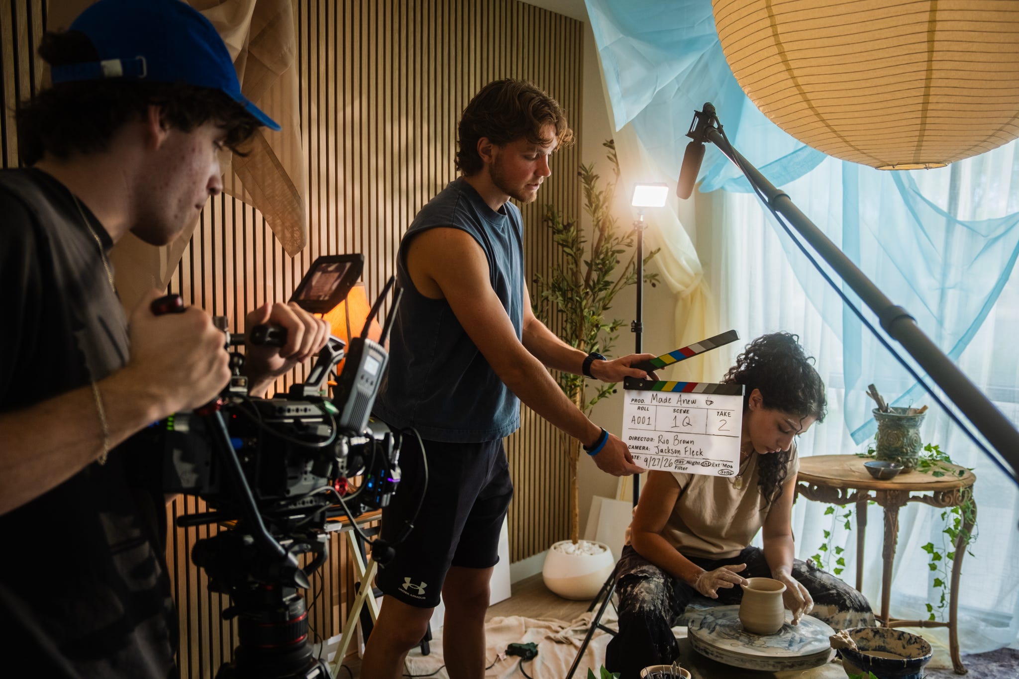Made Anew camera crew slating a ceramics scene during production